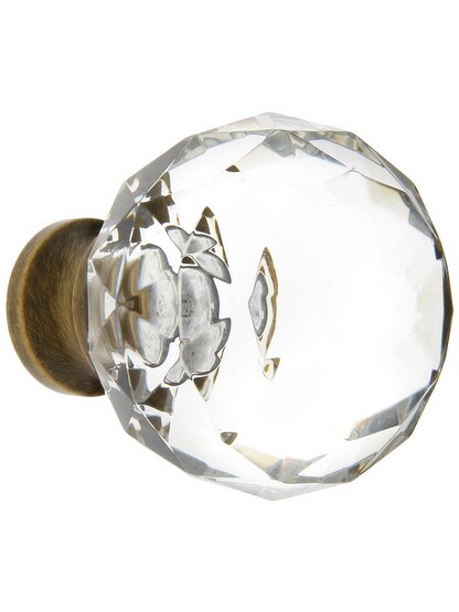 Medium Globe Style Cut Crystal Knob With Solid Brass Base in Antique Brass.